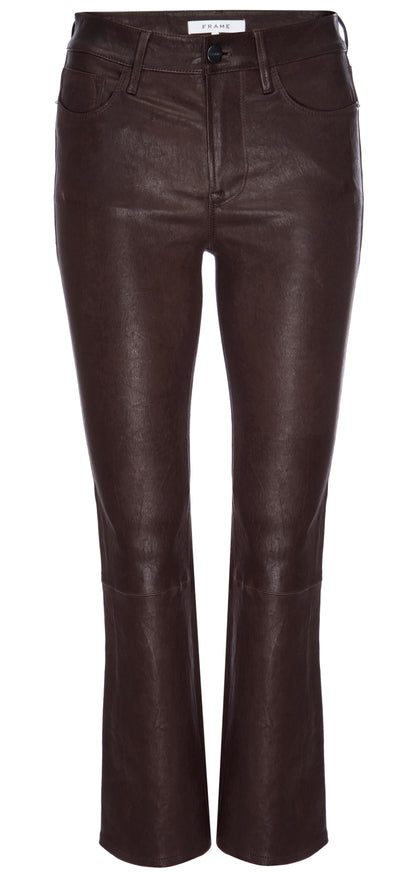 The Le Crop Mini Boot Leather Pants by Frame are a stylish addition to any wardrobe, showcased against a white background. These dark brown leather pants feature a fitted waist, pockets, slightly flared legs, and a brand label sewn inside the waistband.