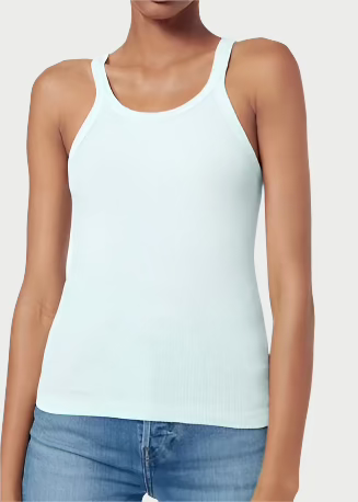 A person wearing a light blue 100% cotton Ribbed Tank from RE/DONE and blue jeans stands against a plain white background. Their face is not visible in the image.