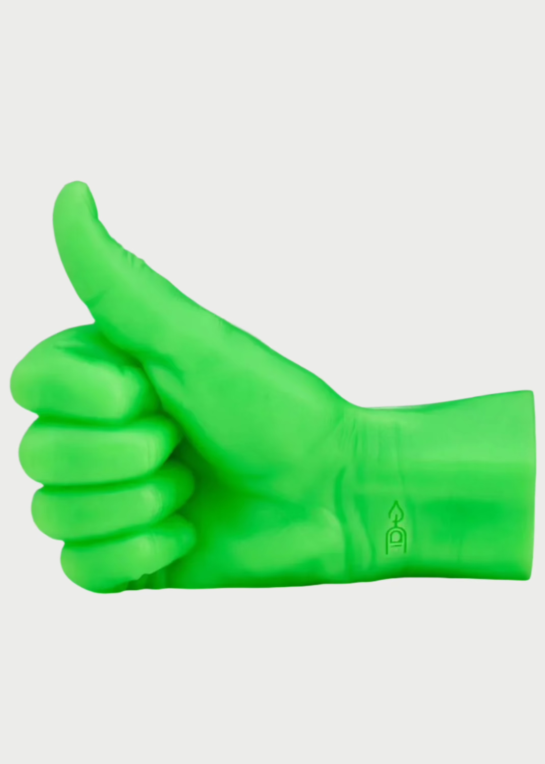 A Thumbs Up Candle from 54° Celsius, in a vibrant green shade, is shaped like a hand making a thumbs-up gesture with a prominent wick protruding from the tip of the thumb. The wrist area features a visible flame symbol and flame rating. This eye-catching candle adds personality to any space, set against a plain white background.