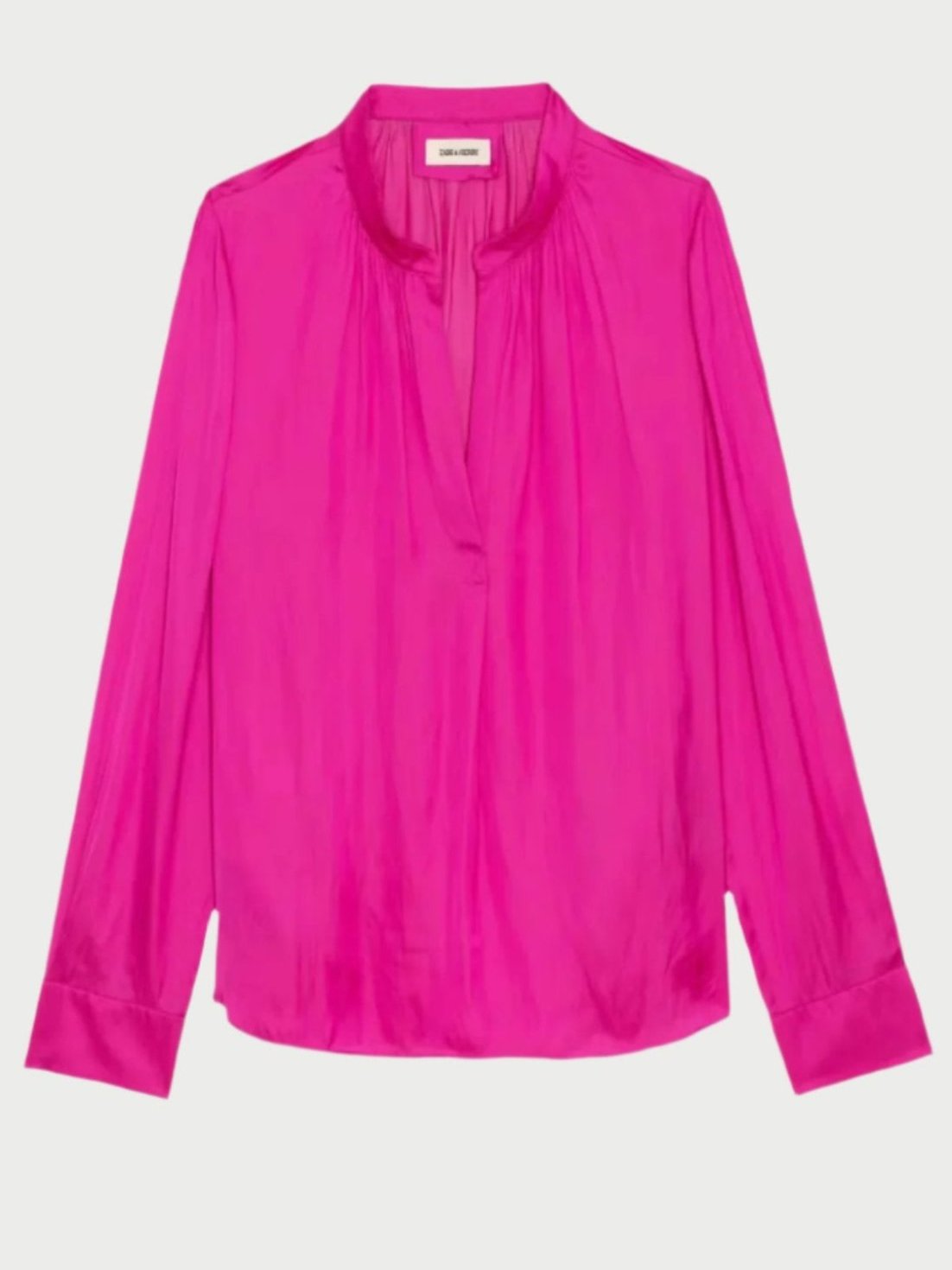 This Bright Pink Satin Blouse by Zadig & Voltaire showcases a relaxed fit and a gathered neckline, expertly crafted from recycled polyester. It features a V-shaped front opening and wide cuffs, making it an ideal choice for elevating any outfit with elegance.