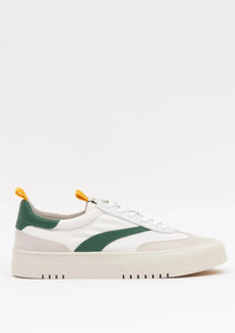 The Oncept Lagos Shoe boasts a contemporary style with vibrant green accents and a thick white sole. This shoe features yellow pull tabs at the heel, slightly perforated detailing near the toe, white laces, and a curved green stripe on the side.