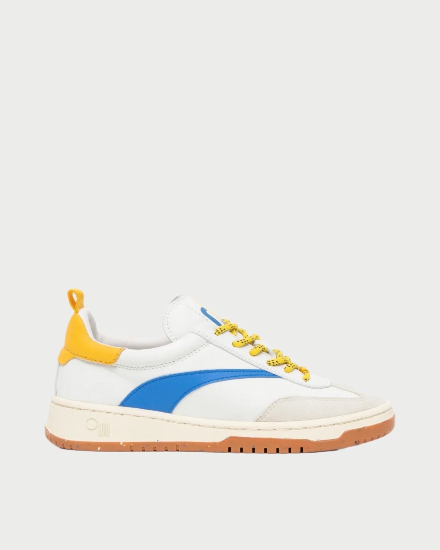 The Panama Shoe by Oncept is a stylish white sneaker with blue and yellow accents. It features eye-catching yellow laces, a beige sole, a bold blue stripe on the side, and a distinctive yellow heel tab. These comfortable shoes are perfect for transitioning from turf to street, all set against a simple white background.