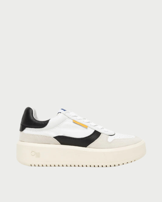 The Oncept Prague Sneaker boasts a white and beige calf leather design with black accents. It features a platform silhouette, chunky sole, white laces, perforated toe cap, and a small yellow side tag on a plain backdrop.