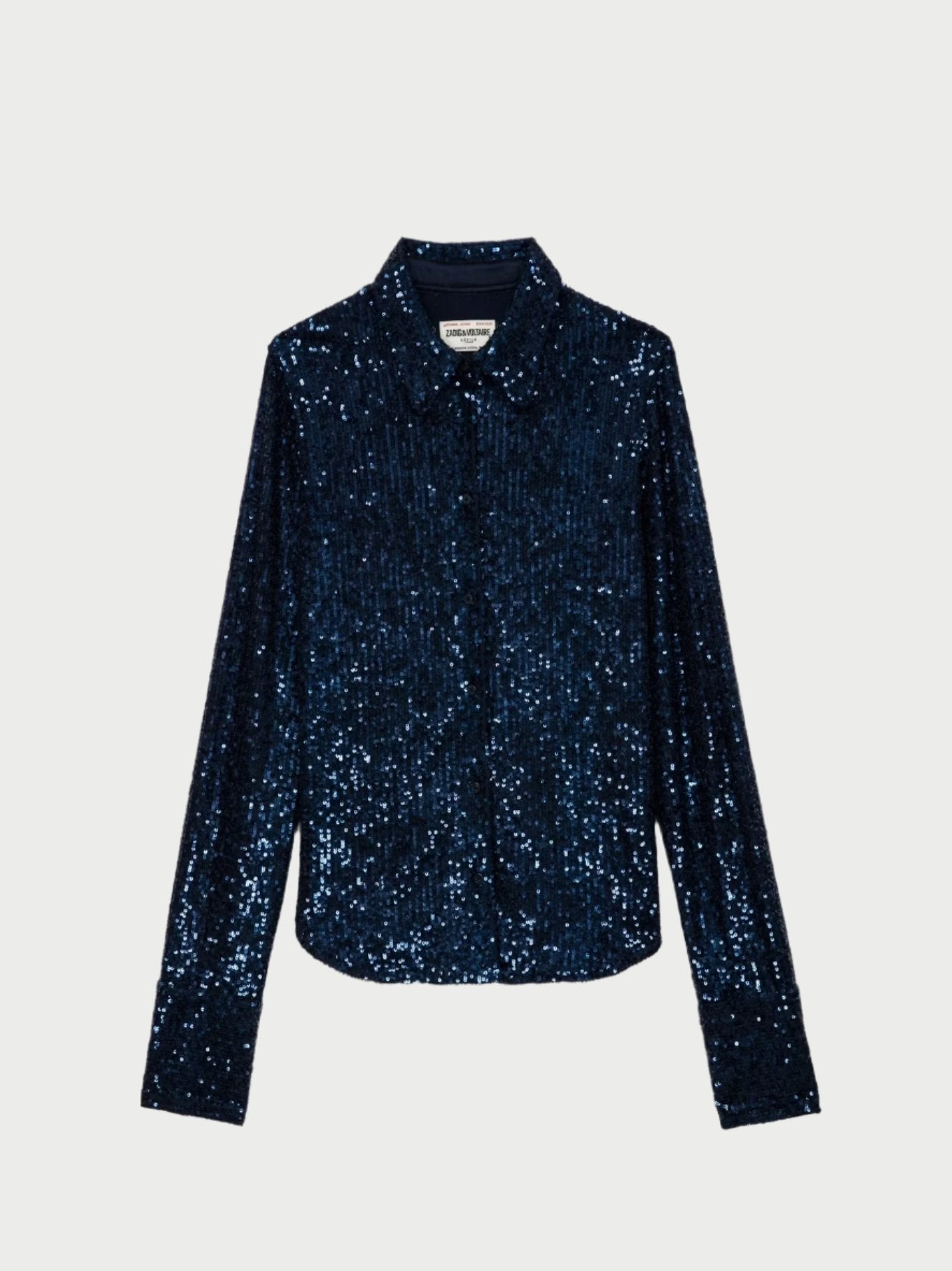 The Tawny Sequin Top from Zadig & Voltaire exudes edgy elegance with its ink blue color, long sleeves, and button-up design set against a simple backdrop.