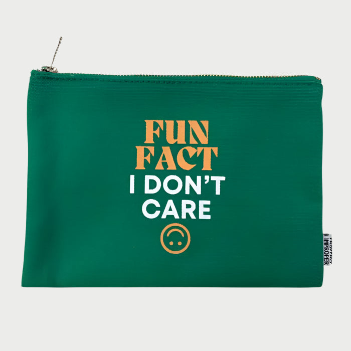 The Properly Improper's "Improper Pouches" is a durable green zippered pouch with "FUN FACT I DON'T CARE" in bold and a small sad face emoticon below. It includes a convenient side tag, making it an ideal quirky gift.