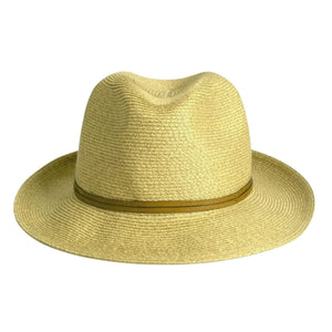 A beige straw fedora Summer Hat with a brown leather band around the base of the crown. The hat has a slightly pinched top and a wide, slightly curved brim. Its textured appearance is reminiscent of Travaux en Cours' signature style, perfect for fans of textured summer hats.