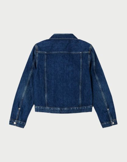 Back view of RE/DONE's Baby Trucker Jacket in classic indigo features long sleeves with silver button cuffs, double stitching, and a pointed collar for a casual yet timeless look.