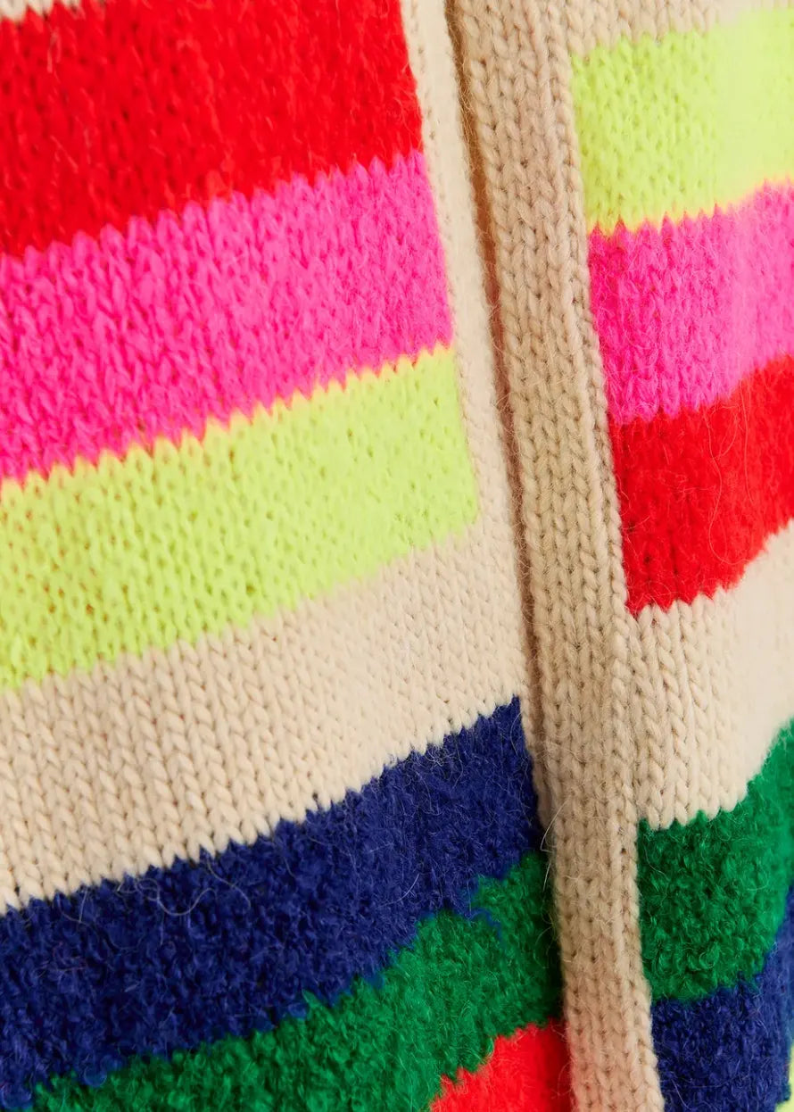 Close-up of the Garis Knitted Scarf by Essentiel Antwerp, featuring horizontal stripes in bright neon colors like red, pink, yellow, green, and blue, separated by beige sections. The luxurious blend of the heavyweight knit material is visible, showcasing intricate stitching and seam details.