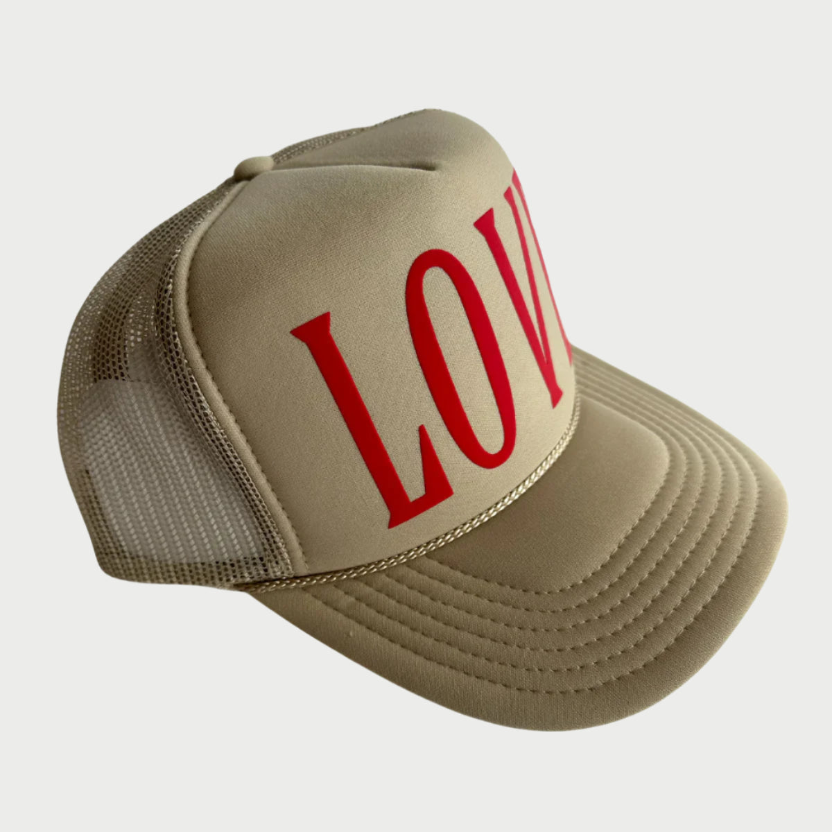 The Love Trucker Hat by LOCAL BEACH is a cute beige hat with a mesh back, featuring a bold red "LOVE" on the front. It's perfect for sunny beach days, offering a curved brim and stylish stitching details.