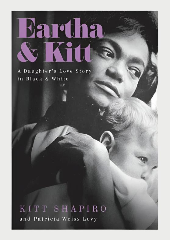 Book cover showing a black-and-white photograph of Eartha Kitt holding a baby, with the title "Eartha & Kitt A Daughter's Love Story In Black & White" written above in purple font. This heartfelt daughter's tribute by authors Kitt Shapiro and Patricia Weiss Levy is named at the bottom, published under the brand Simon & Schuster.